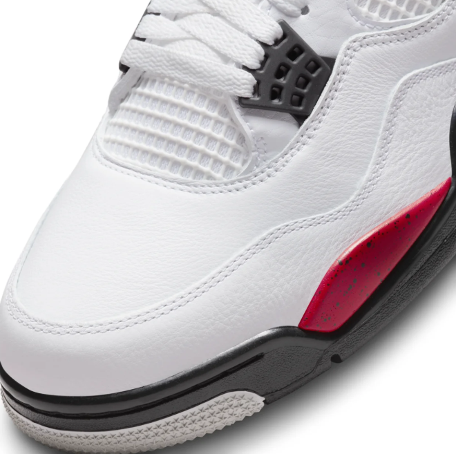 Air Jordan White Sneakers with Red Speckled Side Wings and Black Accents