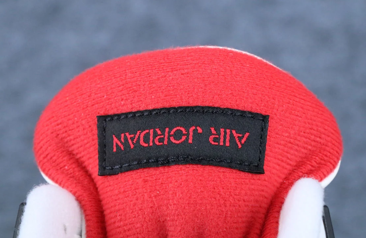 Air Jordan White and Black Sneakers with Flight Club Tongue Patch