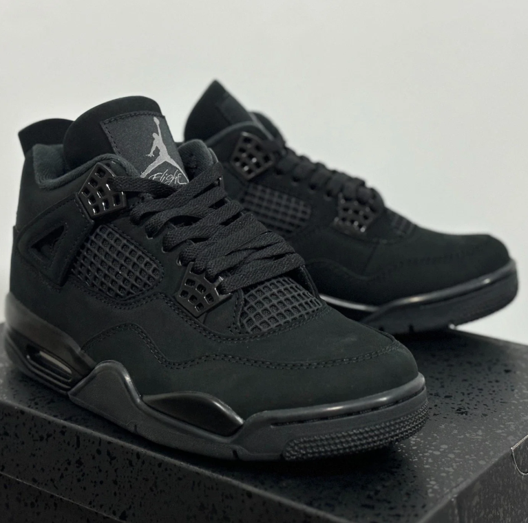 Air Jordan All-Black Sneakers with Grid Panels and Glossy Lace Tabs