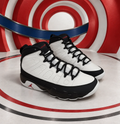 Air Jordan White and Black High-Top Sneakers with Red 23 Heel Details