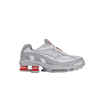 Nike x Supreme Grey and White Sneakers with Red Heel Columns